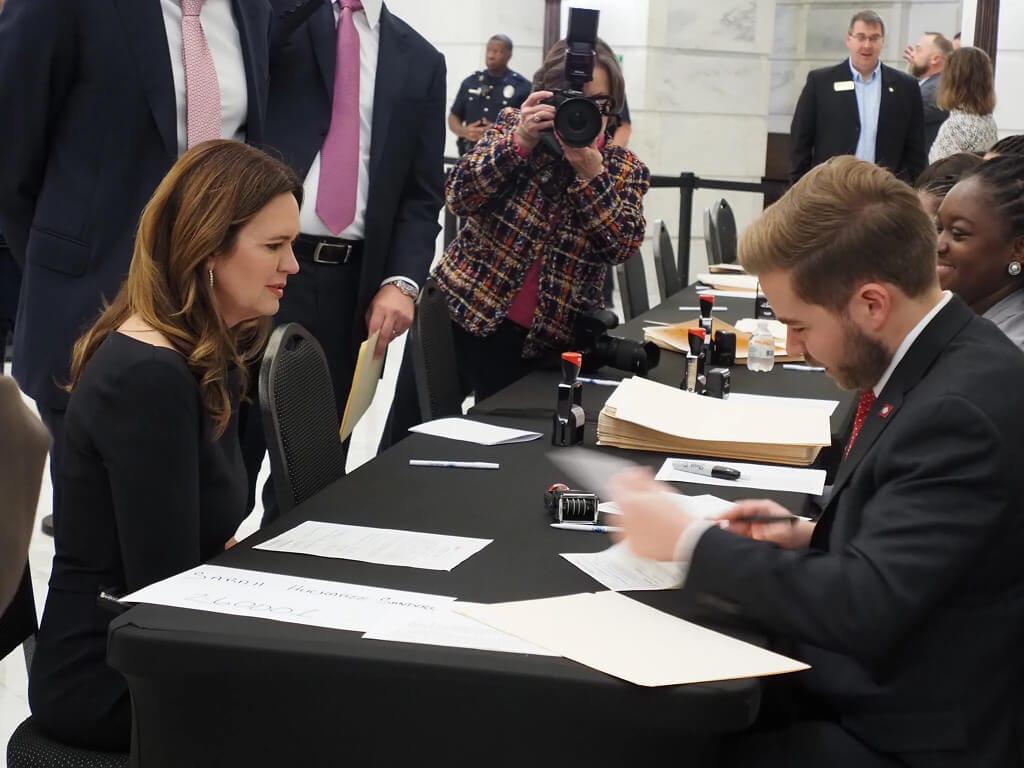 Under Court Pressure, Sanders Sets Special Election Dates as Her Objections Persist